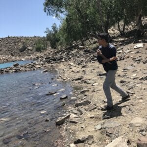 Eesa Ali Mir skipping rocks at the beach