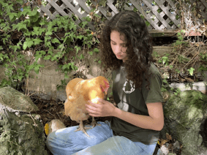 Sequoia Friedman holding a chicken